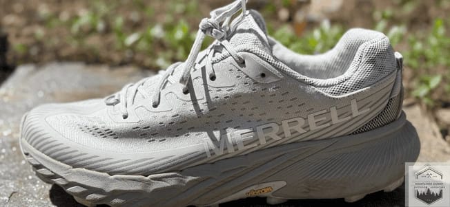 Side profile of the Merrell Agility Peak 5 trail running shoe featuring the FloatPro™ Foam midsole and Vibram® Megagrip outsole, shown during our technical trail field durability test.