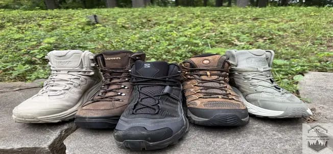 All the top lightweight hiking boots lined up on a wall