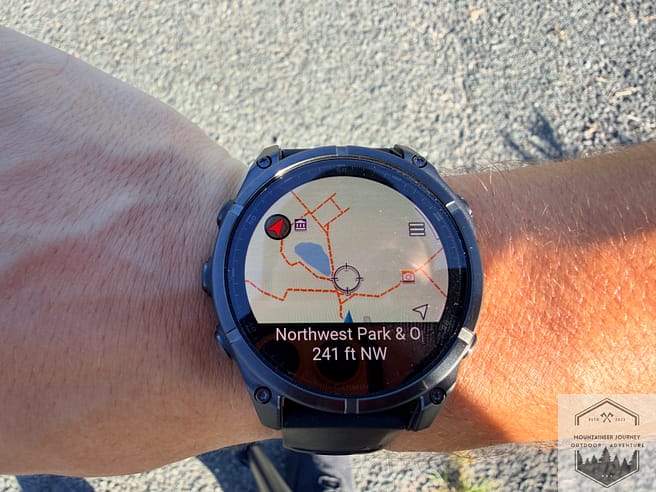 Garmin Fenix 8 watch face view with mapping features during a hike.