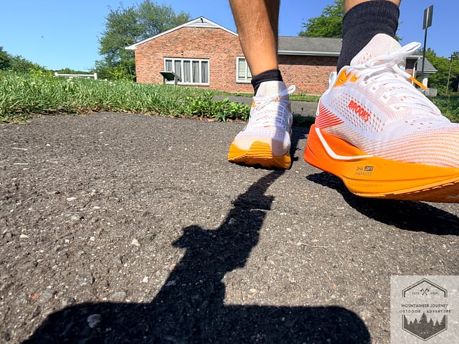 Front view of shoes while walking on downhill asphalt during testing