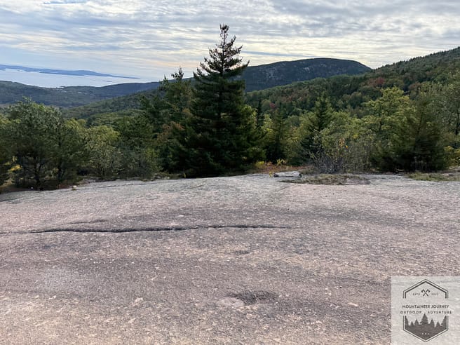 Open granite section on Cadillac Mountain Trail, overlooking water