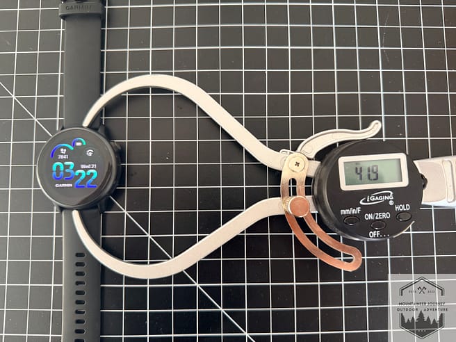 Measuring the Vivoactive 6's length with our digital caliper at 41.9 mm