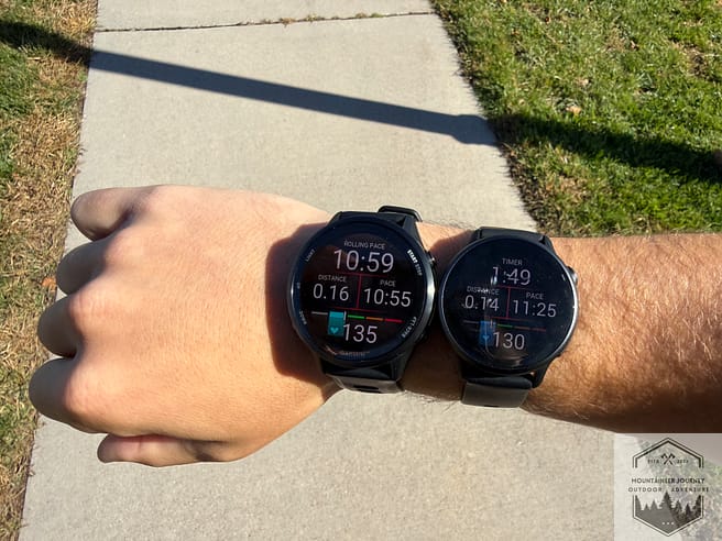 Both the Garmin Vivoactive 6 and the Forerunner 970 on the same wrist, showing distance and pace as well as heart rate