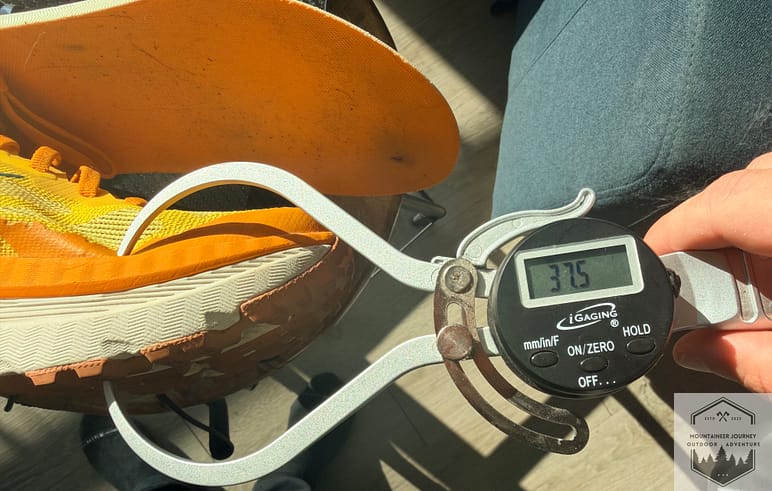 Measuring the Mafate X forefoot stack height at 37.5mm with our digital caliper.