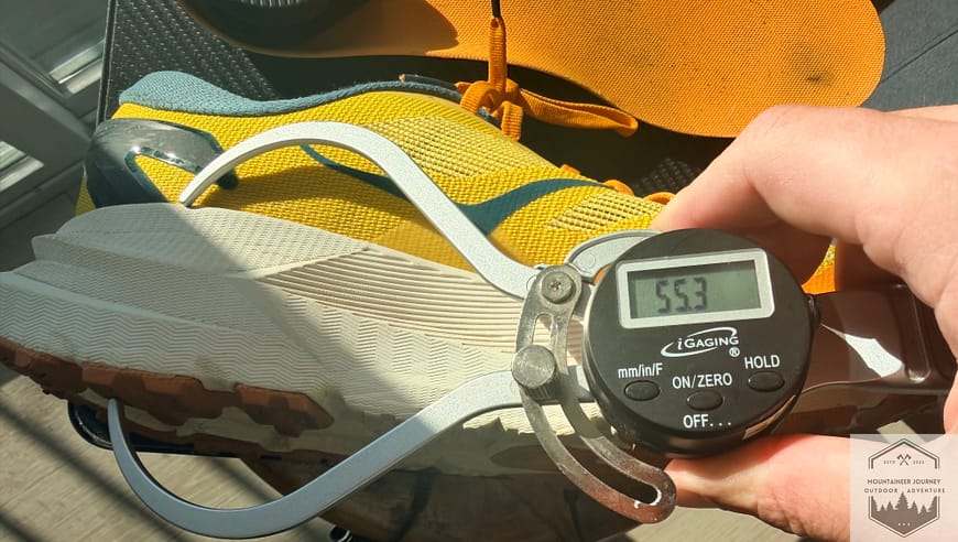 Measuring the heel stack height of the Hoka Mafate X at 55.3 mm with our digital caliper