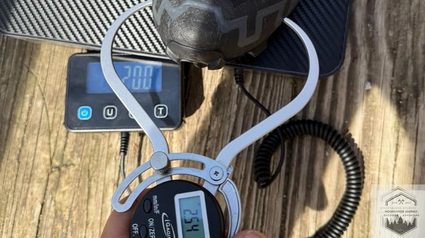 Measuring the Salomon Speedcross 6 toe box at 2.54 inches with a digital caliper, providing objective data on the shoe's narrow, precision-fit forefoot.