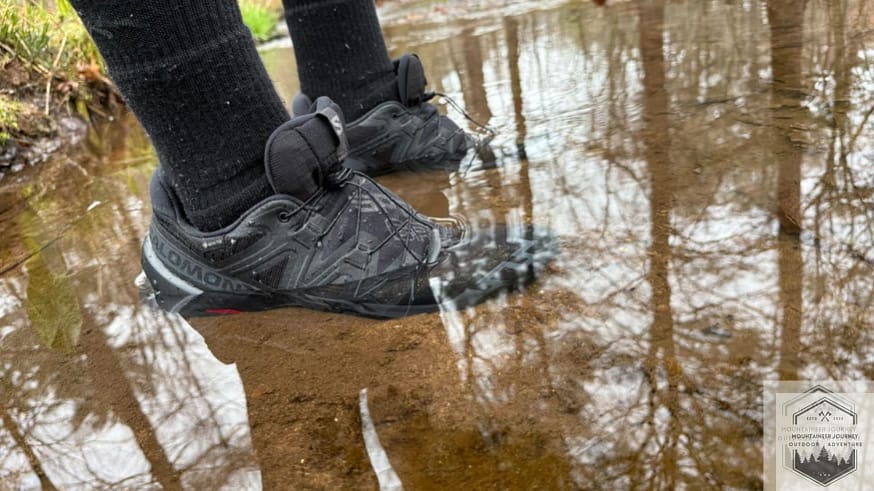 Testing the waterproofness of the salomon speedcross 6 in a creek during our 10 minute submersion test