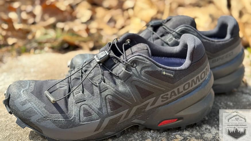Testing the Salomon Speedcross 6 waterproof membrane during a 10-minute creek submersion test to verify the Gore-Tex protection against moisture ingress.