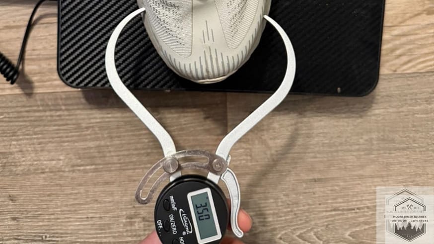 Measuring the Merrell Agility Peak 5 toe box width with a digital caliper at 3.50 inches to verify forefoot volume and fit.