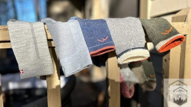 blog-img-1732997034133 different types of hiking socks ranging from synthetic to merino wool