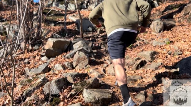trail running with speedgoat up rocks