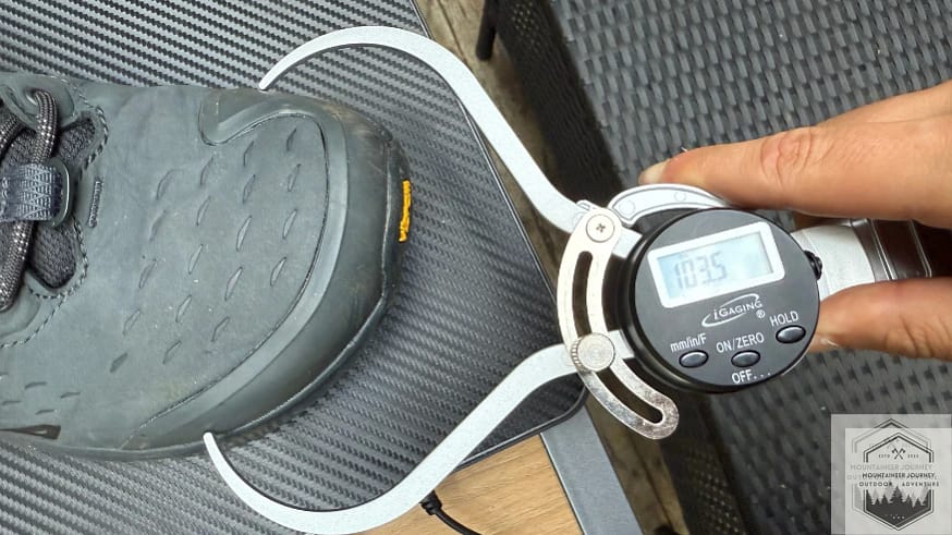 Measuring the Altra Olympus 6 "Original" FootShape toe box with a caliper at 103.5 mm to verify maximum toe splay room.