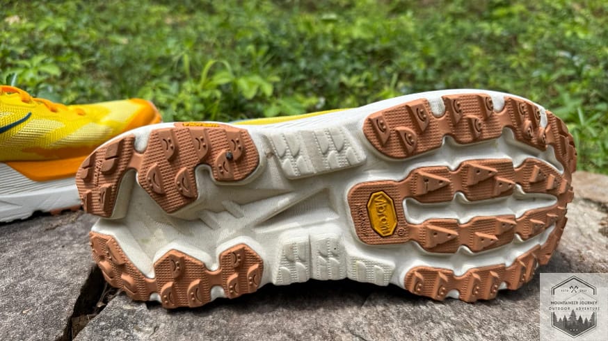 Bottom view of the Hoka Mafate X outsole featuring Vibram Megagrip rubber and 3.5mm lugs for lightweight trail performance.