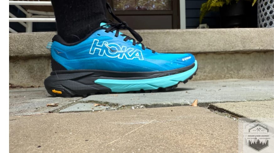 Close-up side profile of the Hoka Mafate 5 showing the texture of the woven textile mesh.