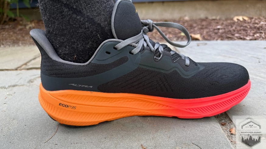Full view of the Altra Experience Flow 2 on concrete during traction testing to evaluate the grip of the updated rubber outsole and rockered geometry
