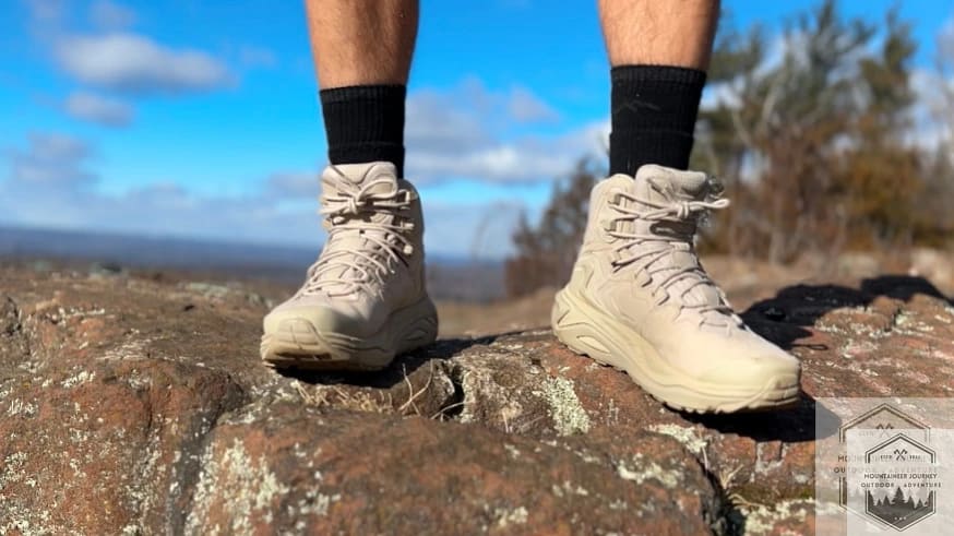 Standing on rock with Hoka Kaha 3 testing the comfort