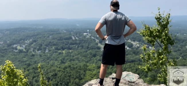 Testing out hiking boots at the top of a mountain