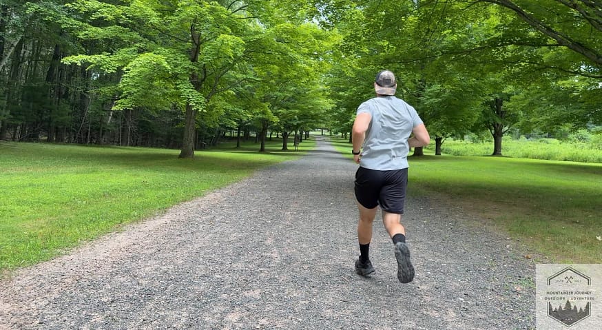 Testing the Hoka Challenger 8 traction on a loose gravel path to evaluate the grip of the 4mm multi-directional lugs and Durabrasion rubber on mixed terrain.