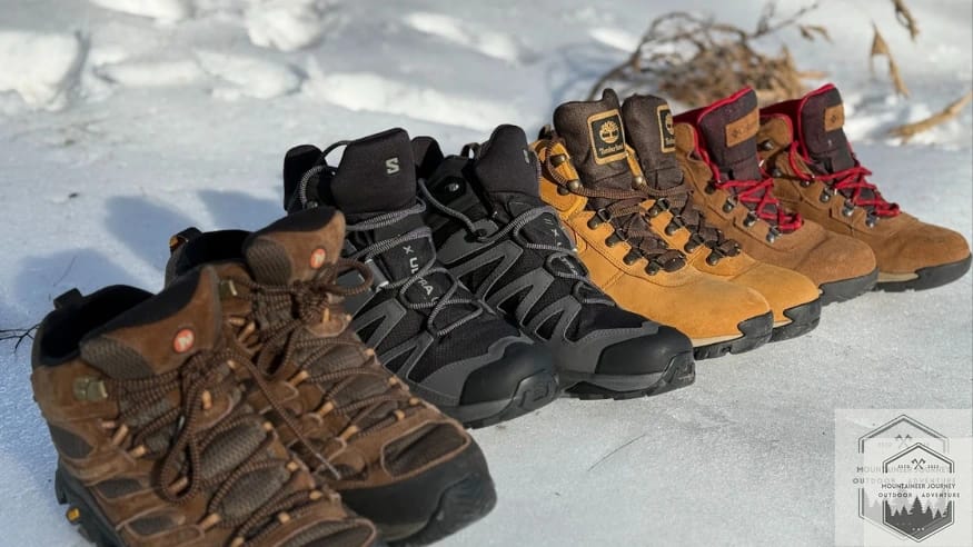 All four budget hiking boots lined up in the snow next to eaohother