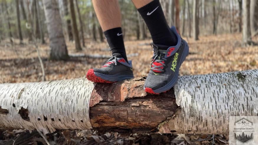 Standing on a log with the challenger 7 showing the forefoot lugs