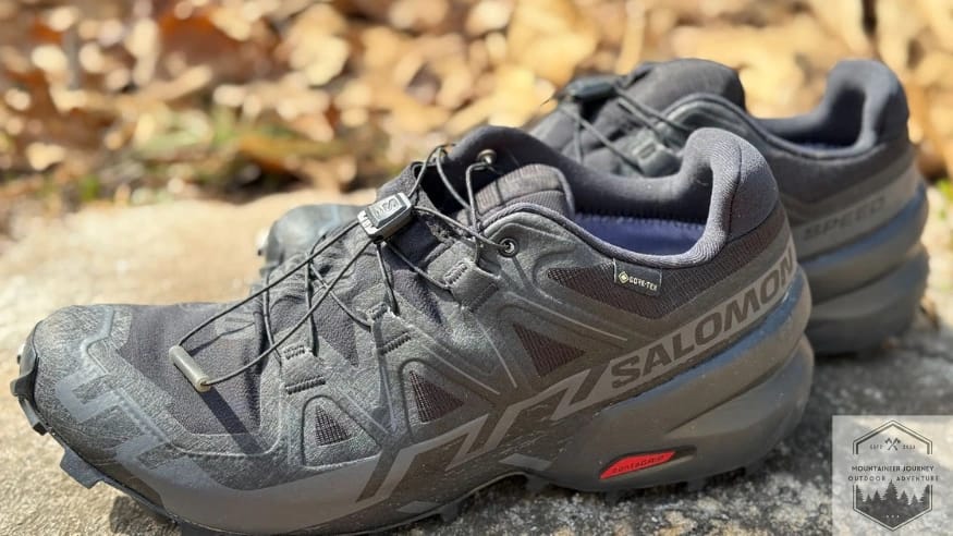 side view of the salomon speedcross 6 on a wall highlighting the outsole and upper