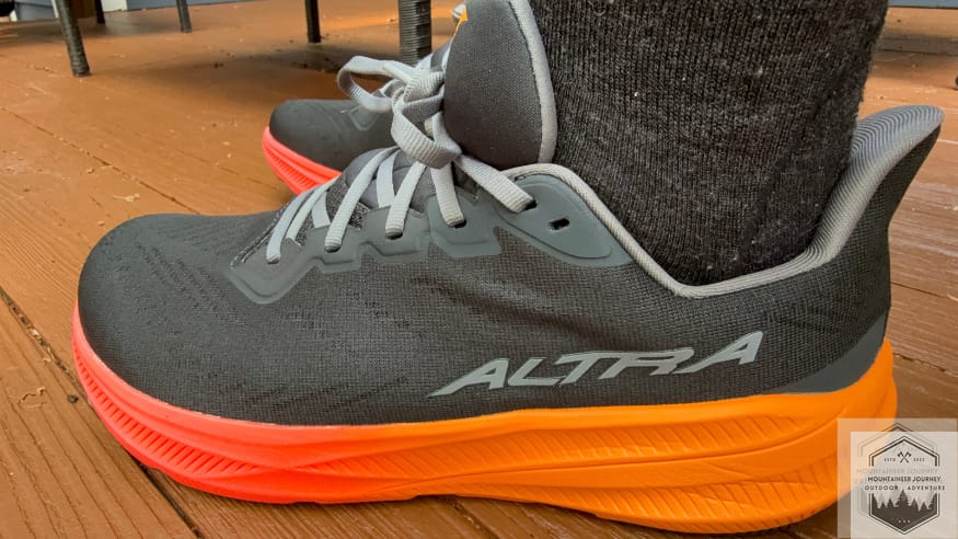 wearing the Altra Experience Flow Experience 2 on a wooden deck