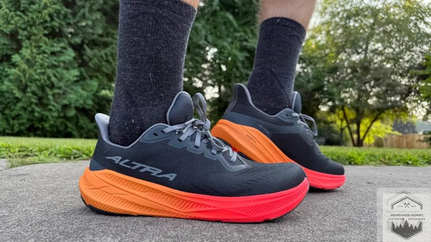 Altra Experience Flow 2 on asphalt testing. Featuring sides of shoe, with left one flexed up